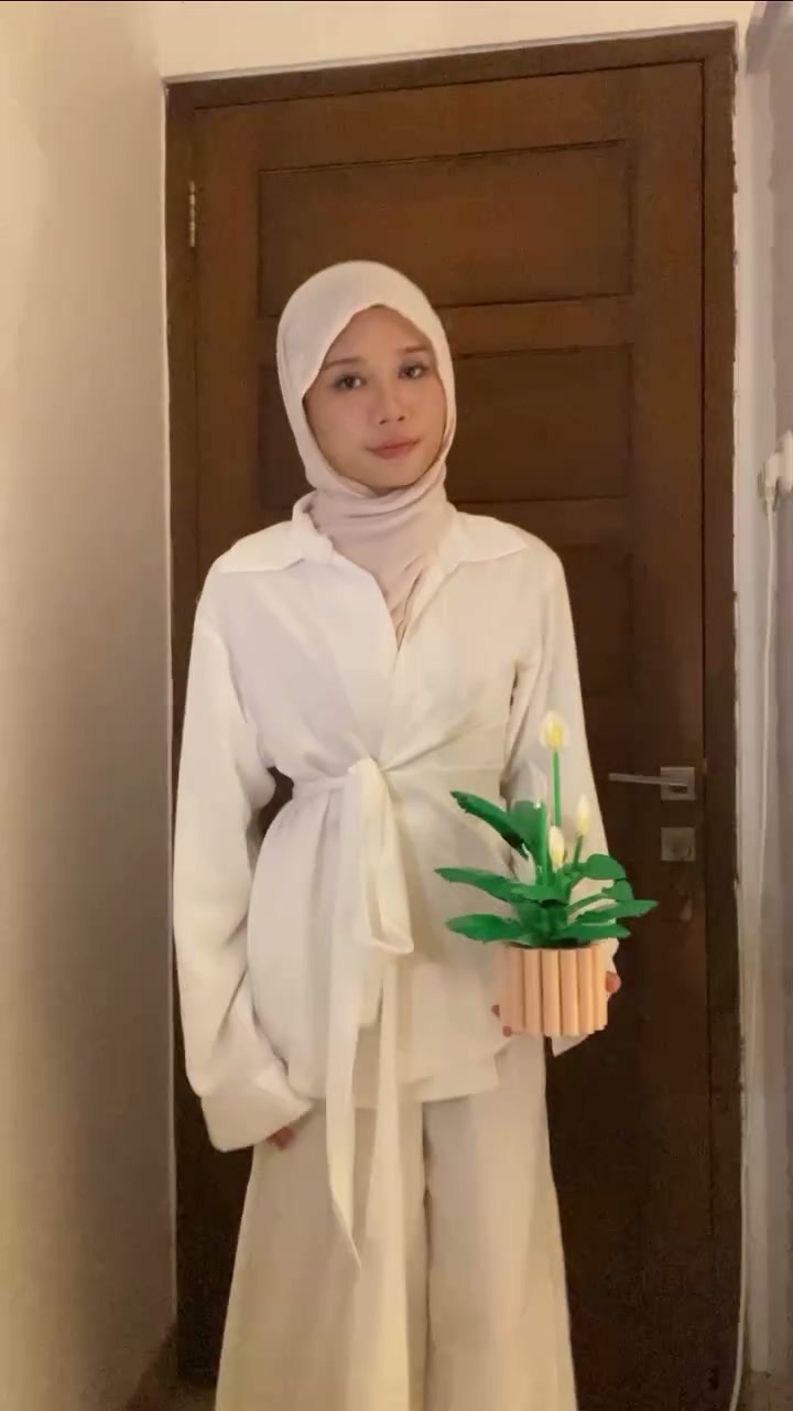 A white layered outfit worn by its maker